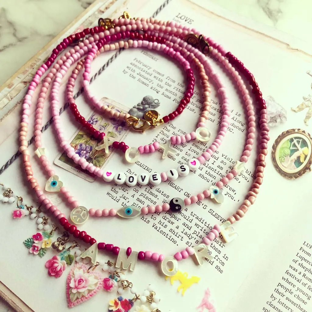 Mother of Pearl Symboleyes Glass Bead Necklace